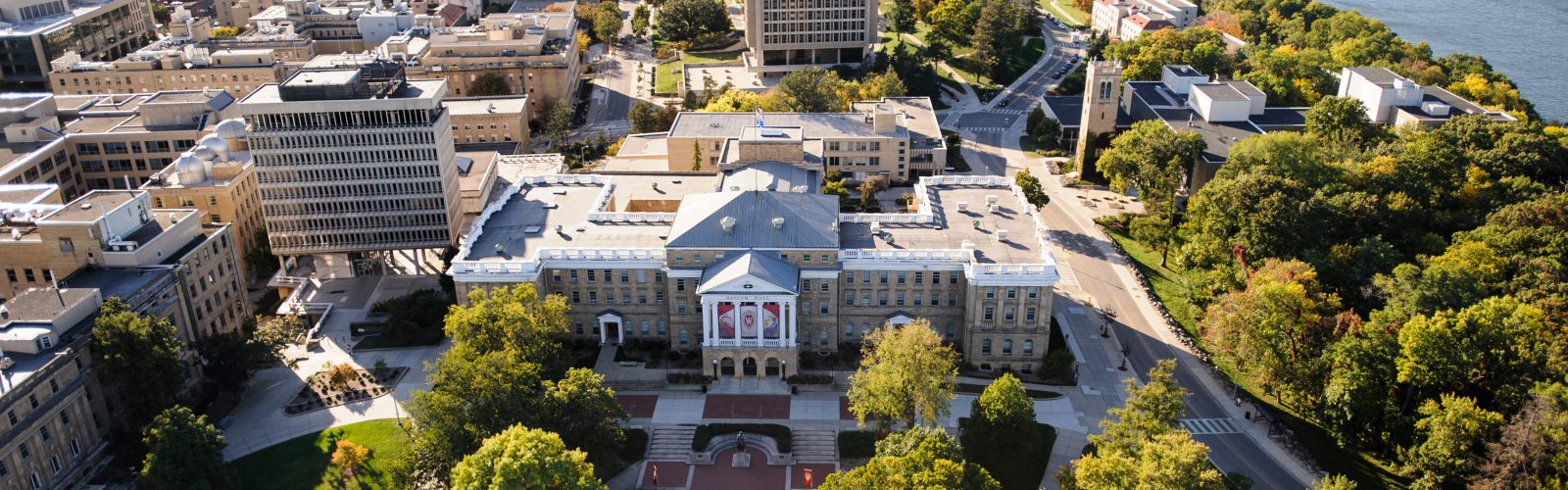 Bascom Hall, Bascom Hill and the central University of Wisconsin-Madison campus are pictured in an aerial view during autumn on Oct. 12, 2013. Clockwise from the left, major campus facilities include South Hall, Birge Hall, Van Vleck Hall, Van Hise Hall, Carillon Tower and North Hall. In the background at right is Lake Mendota. The photograph was made from a helicopter looking west. (Photo by Jeff Miller/UW-Madison)